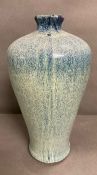 A Studio pottery vase with blue/green glaze H 41 cm