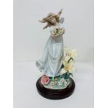 A boxed Lladro porcelain figurine "Mystical Garden" No 6686 Condition Report Has broken pebbles