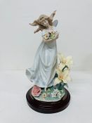 A boxed Lladro porcelain figurine "Mystical Garden" No 6686 Condition Report Has broken pebbles