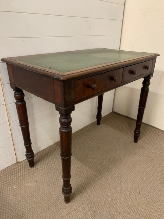 A mahogany writing table with leather top on turned legs (H7cm W91cm D52cm) - Image 5 of 6