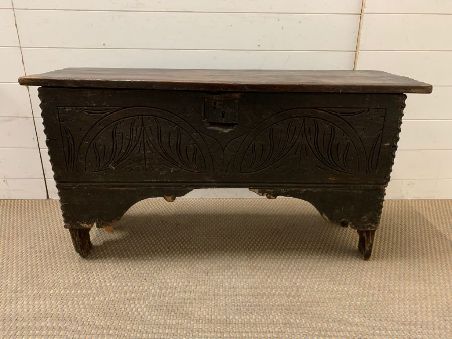 An Oak chest front carved and cut outs to end (104 cm x 33cm x 56cm) Possibly Scottish or Welsh.