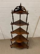 A five tier mahogany whatnot corner shaped with turned supports (H137cm W65cm)