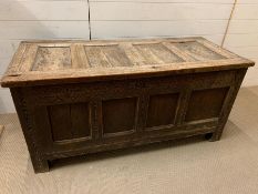 A 17th Century four panelled Coffer with hinged lid raised on bracket feet 135 L x 58 D x 63H