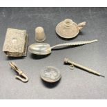 Five assorted silver curios to include matchbox cover, miniature candlestick, thimble etc