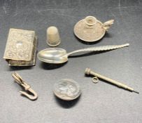 Five assorted silver curios to include matchbox cover, miniature candlestick, thimble etc