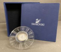 A Boxed Swarovski clock.