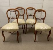 A set of four Victorian walnut dining chairs