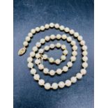 A Pearl necklace with a 14ct gold clasp