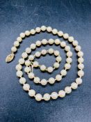 A Pearl necklace with a 14ct gold clasp