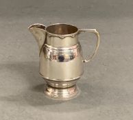 A silver milk jug (150g) hallmarked for Birmingham 1929 by William Devenport