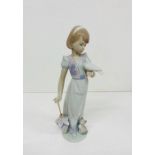 A Boxed Lladro porcelain figurine "Summer Stroll" model no 7611