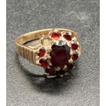 A 9ct yellow gold and garnet ring. (Total Weight 5g)