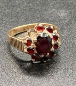 A 9ct yellow gold and garnet ring. (Total Weight 5g)