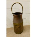 A Copper and brass pail with brass handle and banding.
