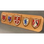 A Cambridge college coats of arms mounted on board