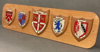 A Cambridge college coats of arms mounted on board