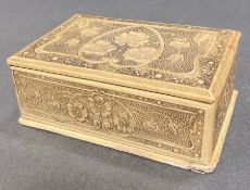 An antique ivory pocket watch box with floral carved design (10 cm wide x 6.7cm deep x 4 cm high)