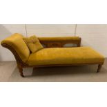 A Chaise Longue in gold velvet with a shaped back.(195 cm L x 70 cm D x 80 cm H)