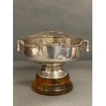 A Silver two handled rose bowl on a wooden stand, with an inscription from 1955. Hallmarked for