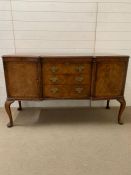 A regency style sideboard flanked by cupboards to end and drawers to centre (H94cm W152cm D56cm)