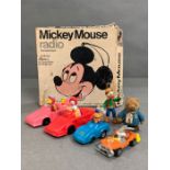 A boxed Mickey Mouse radio, Mcdonalds happy meals toys and a vintage Paddington Bear