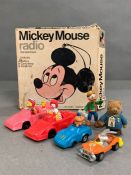A boxed Mickey Mouse radio, Mcdonalds happy meals toys and a vintage Paddington Bear