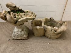 Two moulded garden water features in the style of buckets with animals.
