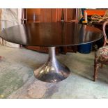 A contemporary dining table on chrome central hammered pedestal (Diameter 150 cm x Height 77 cm)