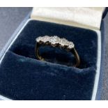 An 18ct gold and platinum five stone vintage diamond ring