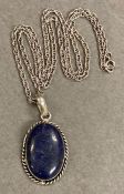 A Lapis Lazuli and silver pendant and necklace