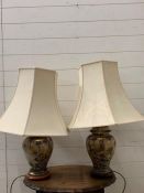 A pair of ginger jar style table lamps decorated with wistra and birds