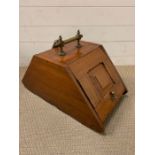 A mahogany coal scuttle with brass handle and shovel