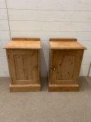 A pair of pine bedside tables with brass handles (H66cm W41cm D33cm)