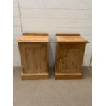 A pair of pine bedside tables with brass handles (H66cm W41cm D33cm)