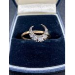 A 9ct gold ring with crescent design.