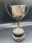 A Hallmarked silver trophy (Total Weight 156g) on separate stand