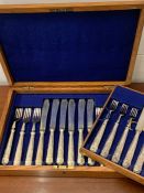 A case set of Mappin and Webb fish knives and forks and a set of dinner knives and forks