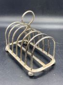 A silver toast rack.