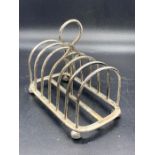 A silver toast rack.