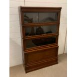 A Four Tier Globe Wernicke bookcase (H 140 cm x D 30 cm x 87 cm)