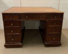 A partners desk with leather top and drawers to both sides (H78cm W122cm D90cm)