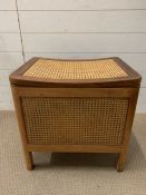 A teak and cane storage stool (H49cm W50cm D38cm)