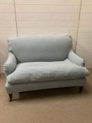 A two seater duck egg blue sofa with loose covers from OKA (H80cm W123cm D70cm)