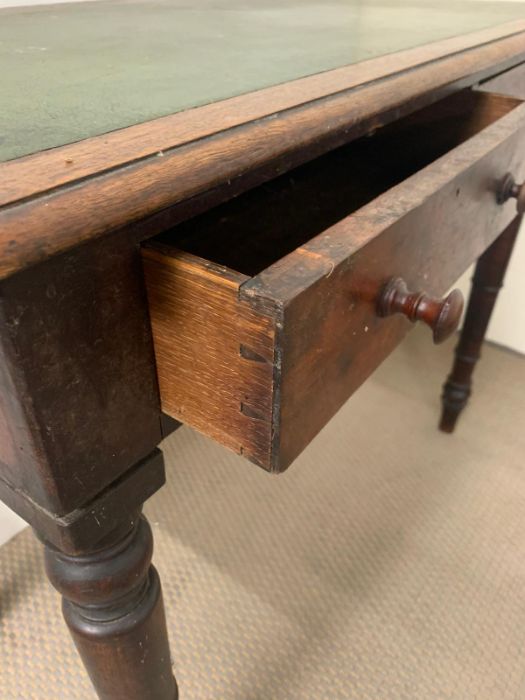 A mahogany writing table with leather top on turned legs (H7cm W91cm D52cm) - Image 3 of 6