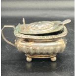 A silver mustard pot with blue glass liner, hallmarked for Birmingham 1886 by Thomas Hayes