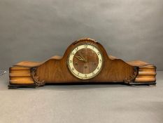 A mantle clock with Westminster chimes.