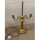 A two arm gilt metal table lamp