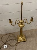 A two arm gilt metal table lamp