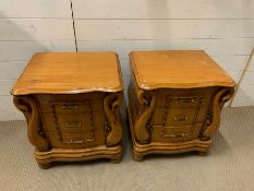 A pair of bedsides with swan details to sides