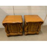 A pair of bedsides with swan details to sides